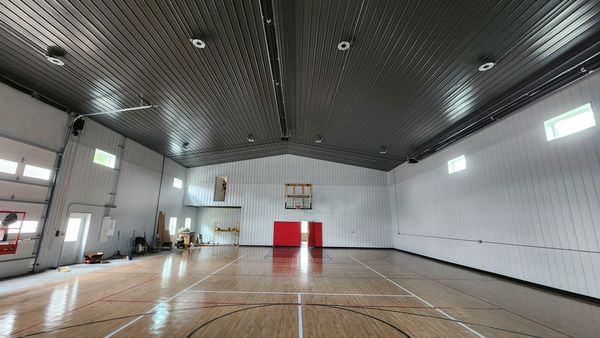 Indoor basketball court building with ceiling lights